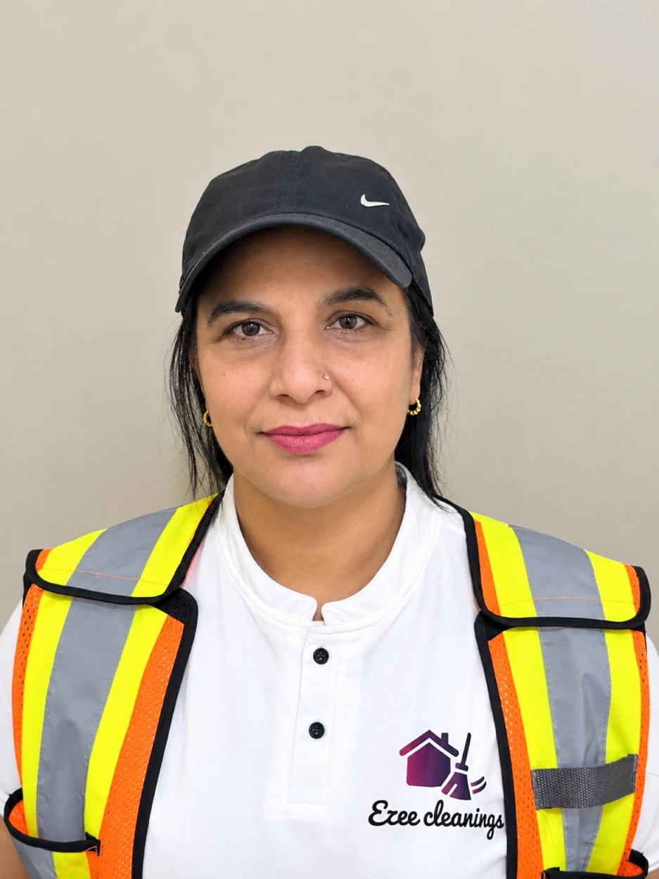 Suman Garg, owner of Ezee Cleanings in Edmonton, in uniform on site